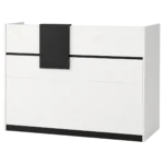 White and black reception counter with cash drawer and shelves
